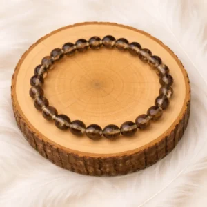 Bracelet quartz fumé en pierres naturelles sur rondin en bois