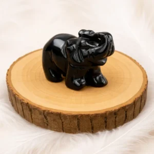 éléphant en obsidienne noire figurine pierre naturelle sur rondin bois