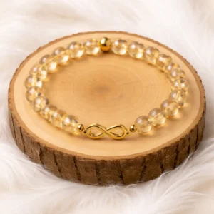 Bracelet aqua aura jaune avec symbole infini sur rondin en bois