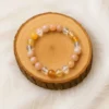 Bracelet Énergie Solaire en Pierre de soleil, Cornaline et Cristal de roche sur un rondin en bois